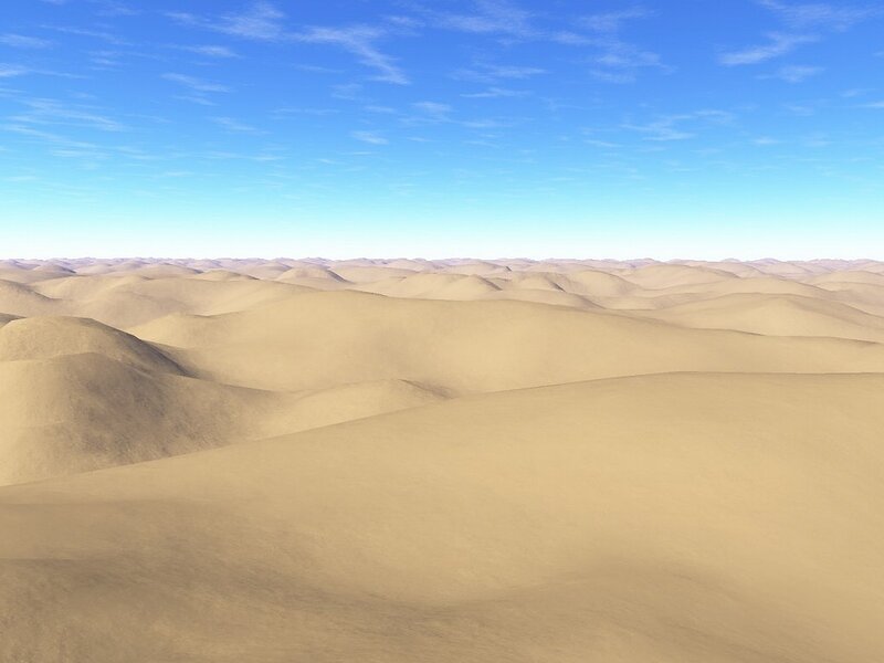 Desert dunes under blue sky