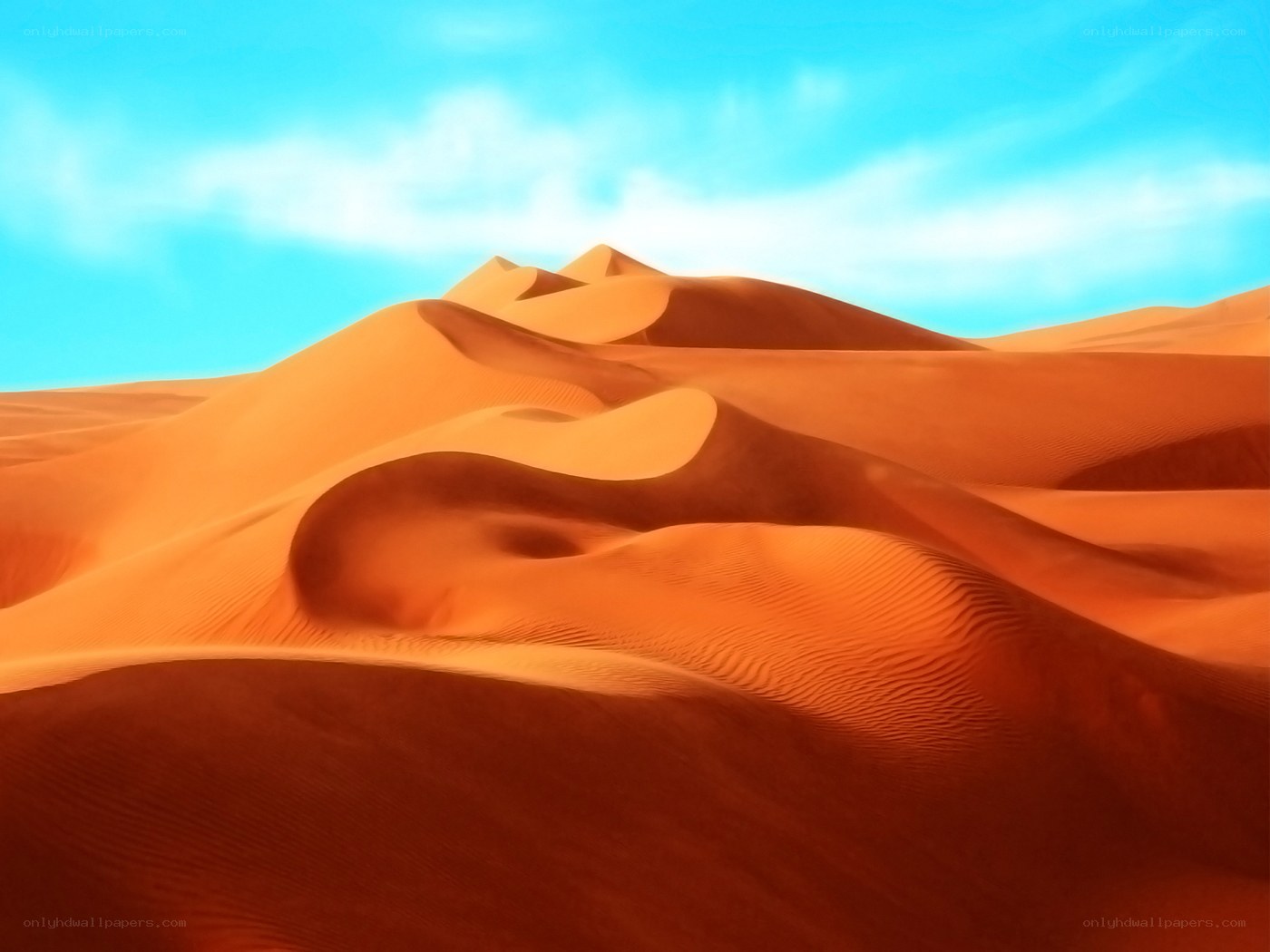 Desert dunes under blue sky