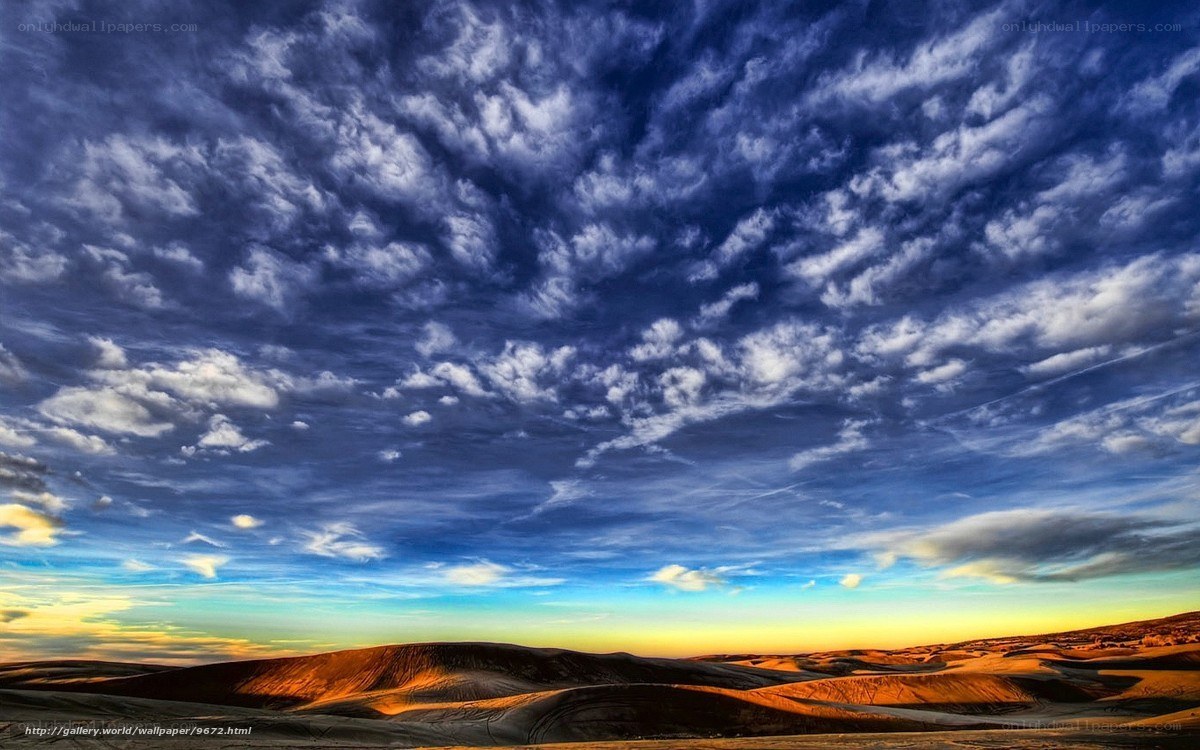Desert Dunes Under Cloudy Sky