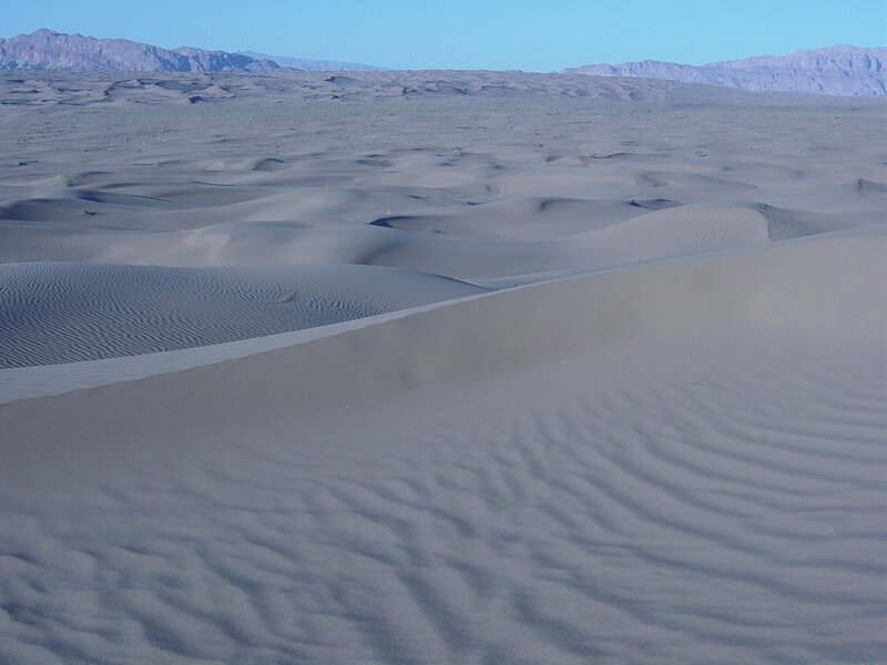 Desert dunes with mountains