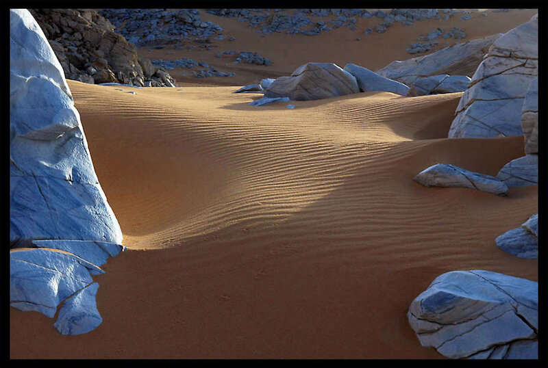Desert dunes with rock formations