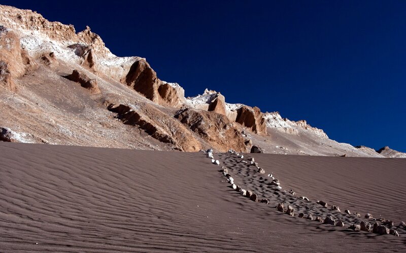 Desert dunes with rocky cliffs