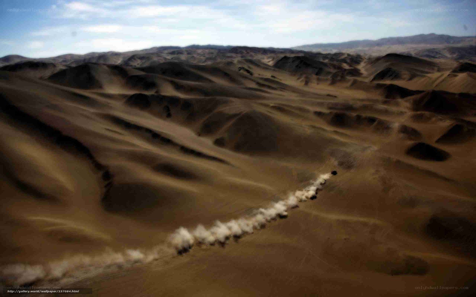 Desert dunes with vehicle trail