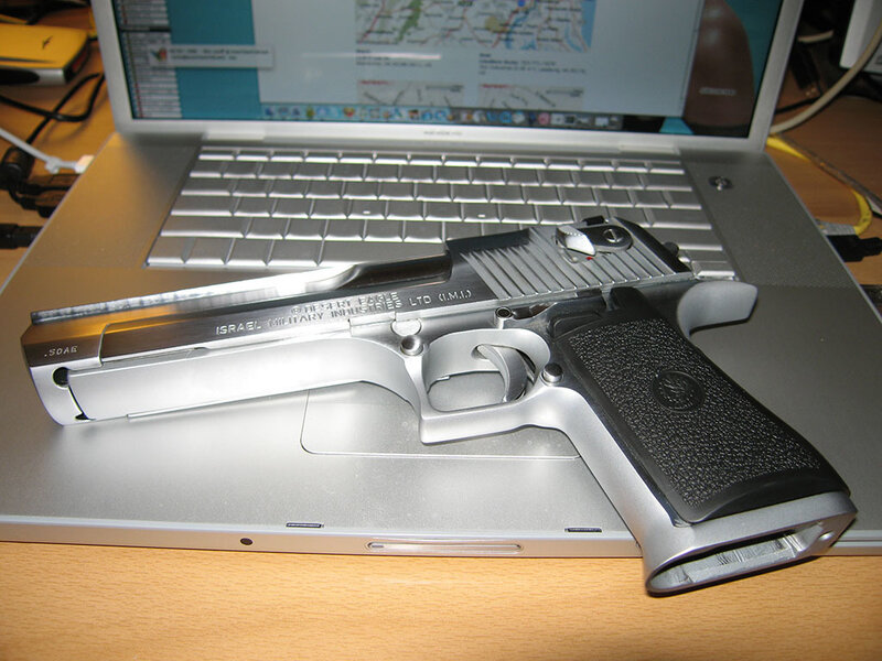 Desert Eagle pistol on laptop
