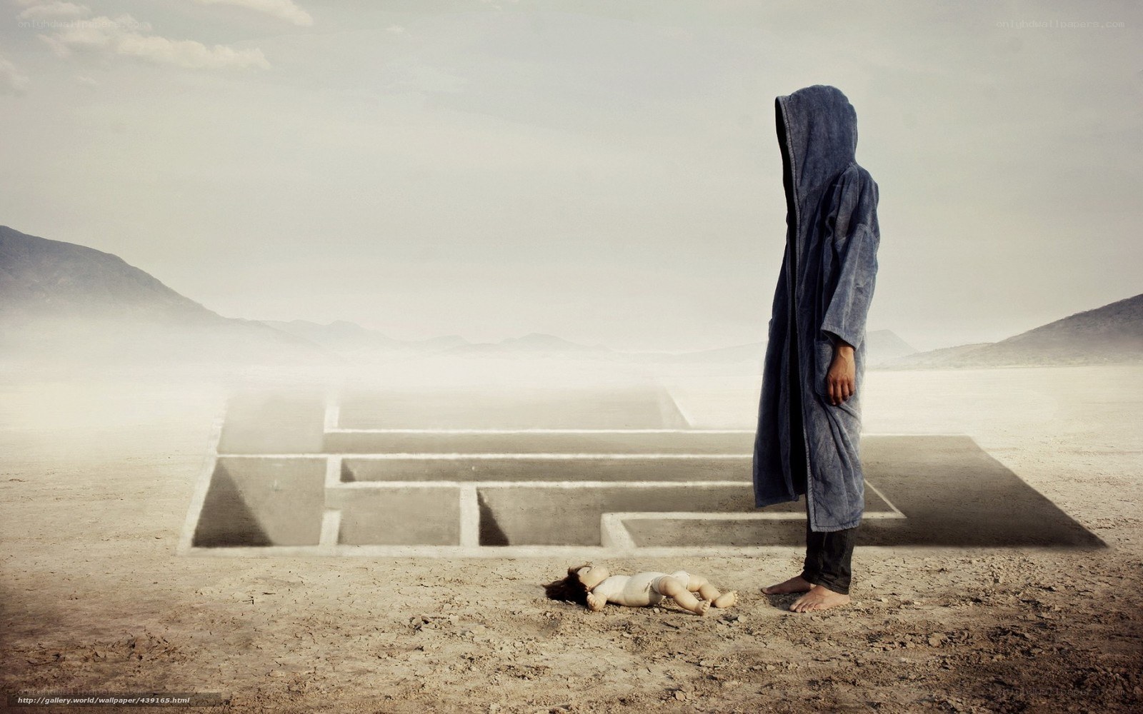 Desert figure with doll