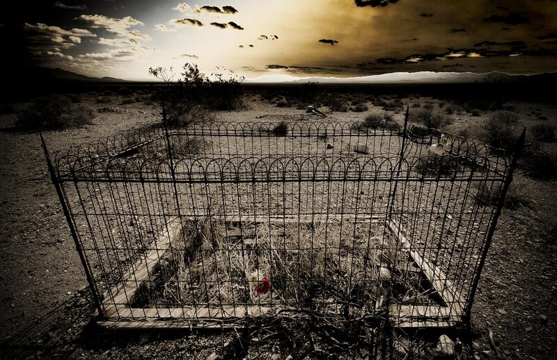 Desert grave with iron fence