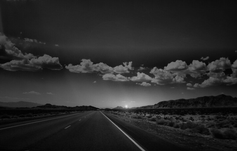Desert highway at sunset