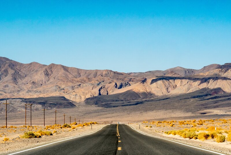 Desert Highway — Blue, Serene, Afternoon, Photograph, Mountains, Power Lines