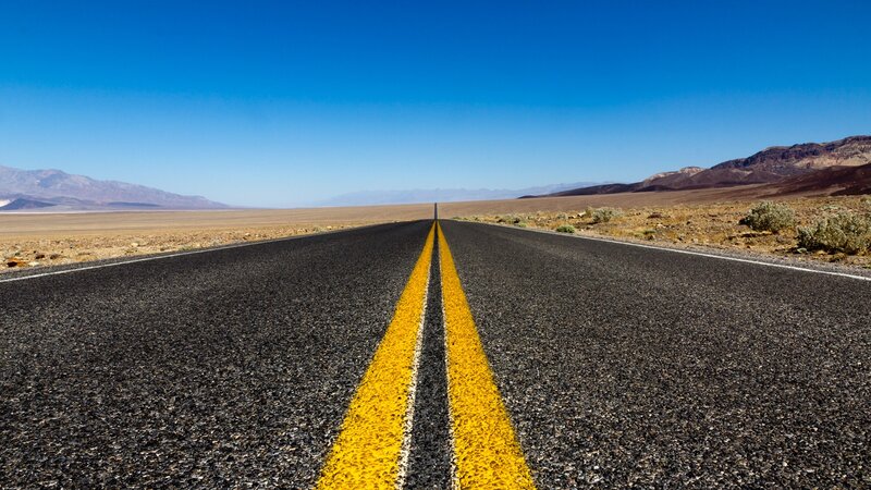Desert highway stretching into horizon