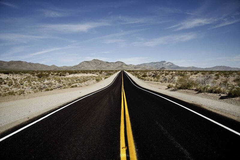 Desert highway stretching to mountains