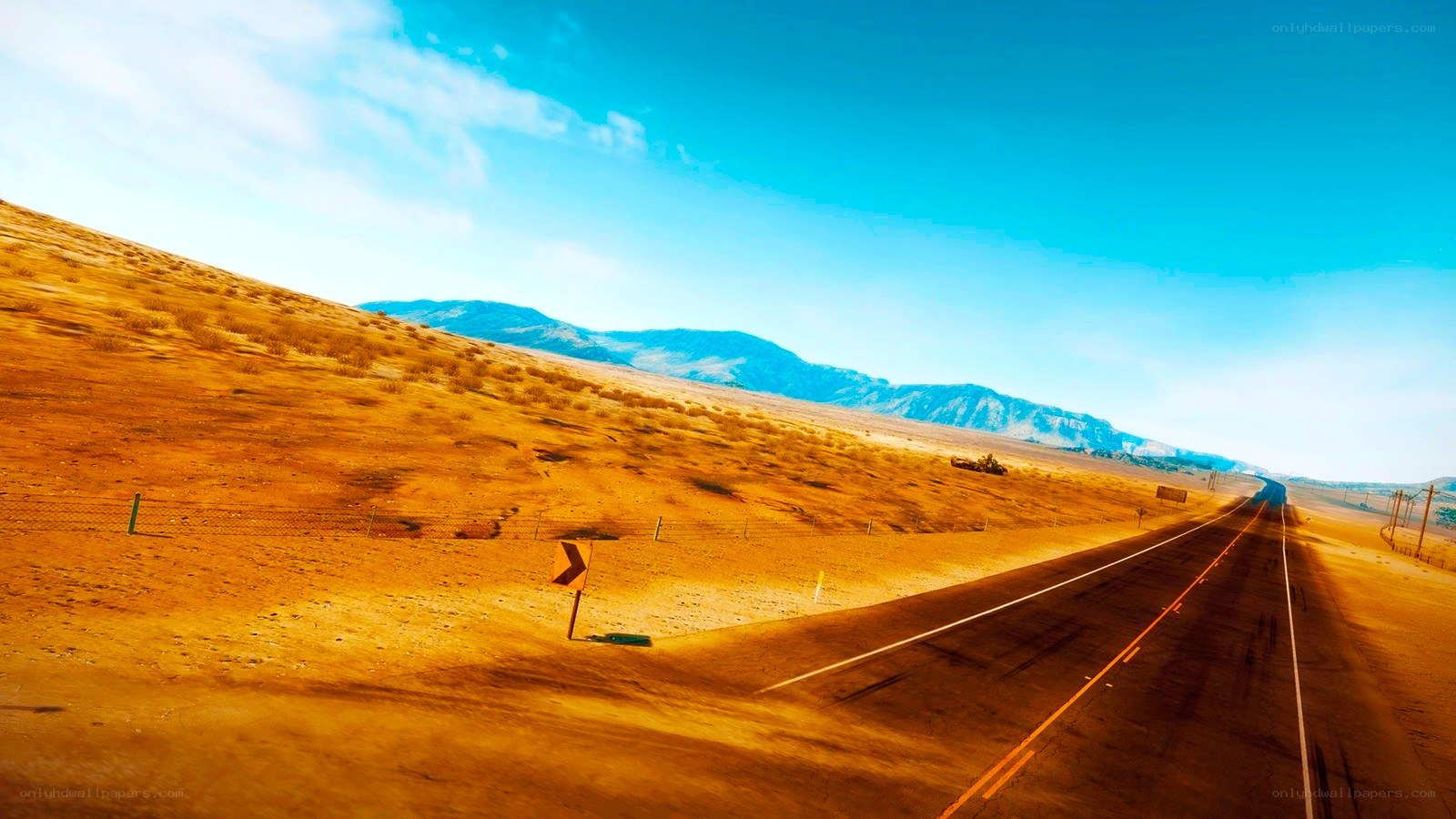 Desert highway under blue sky