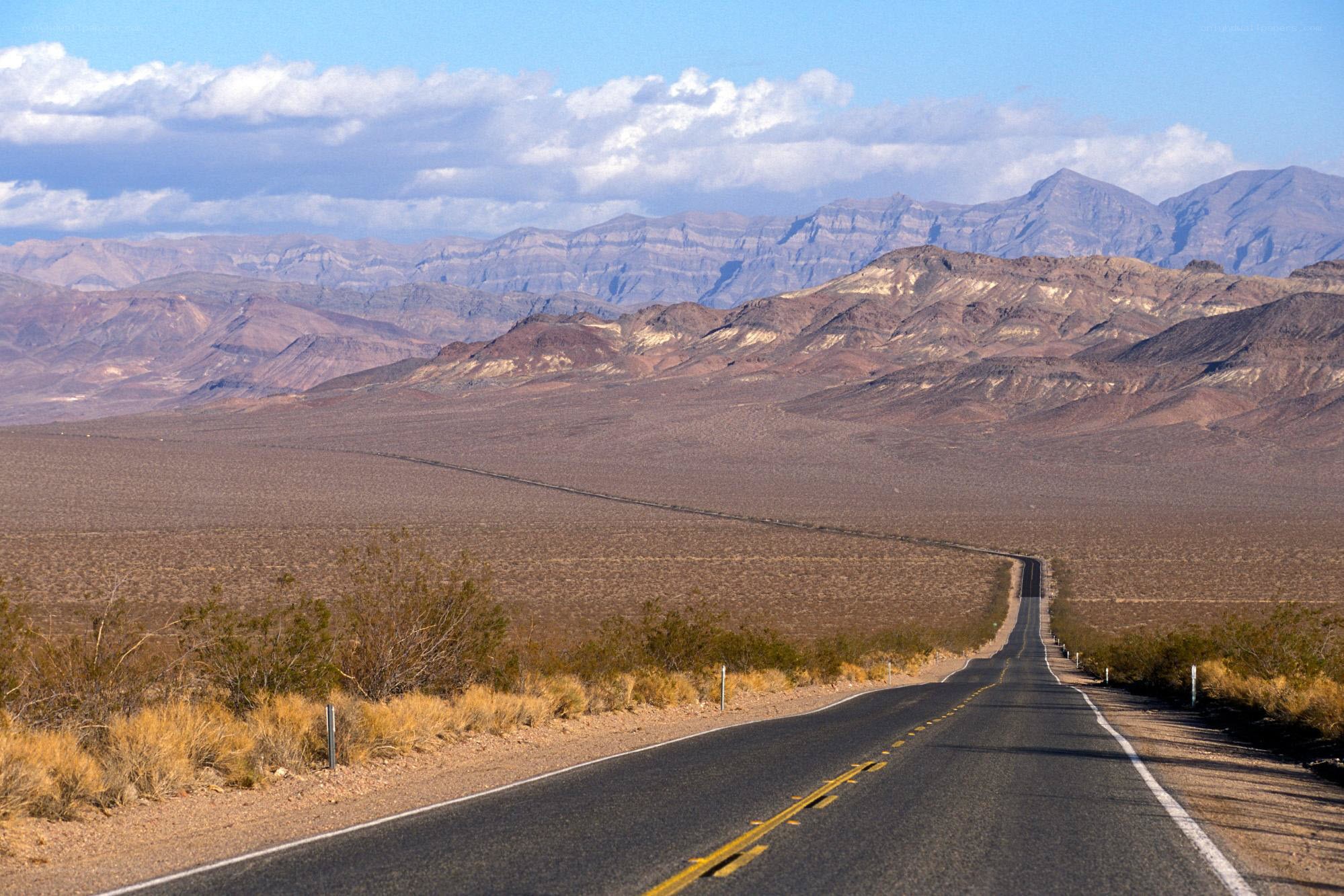 Desert highway with mountains
