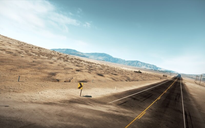 Desert highway with mountains