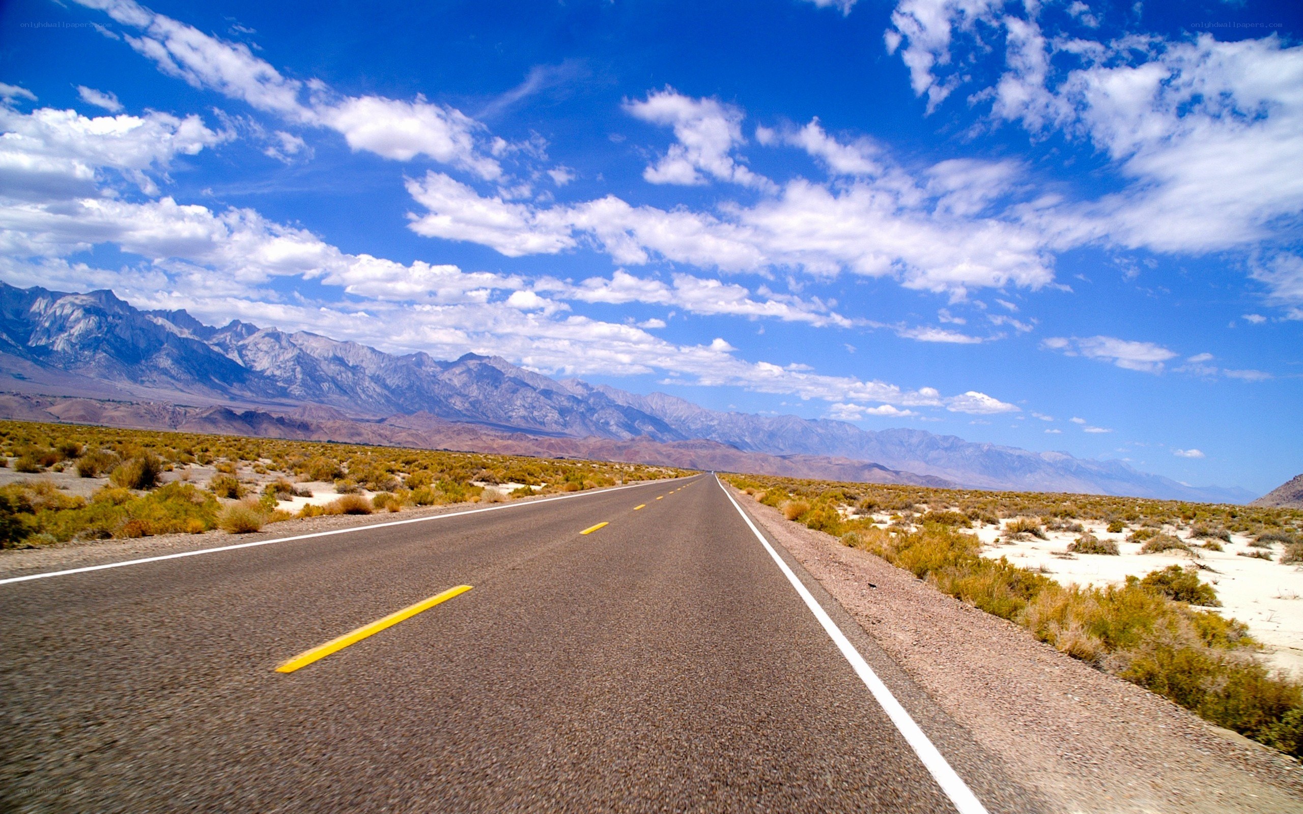 Desert highway with mountains