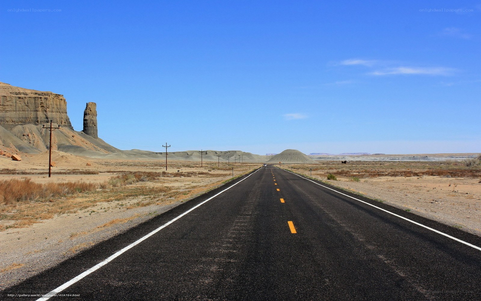 Desert highway with rock formations