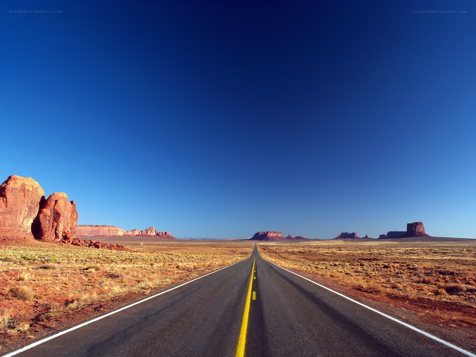 Desert highway with rock formations