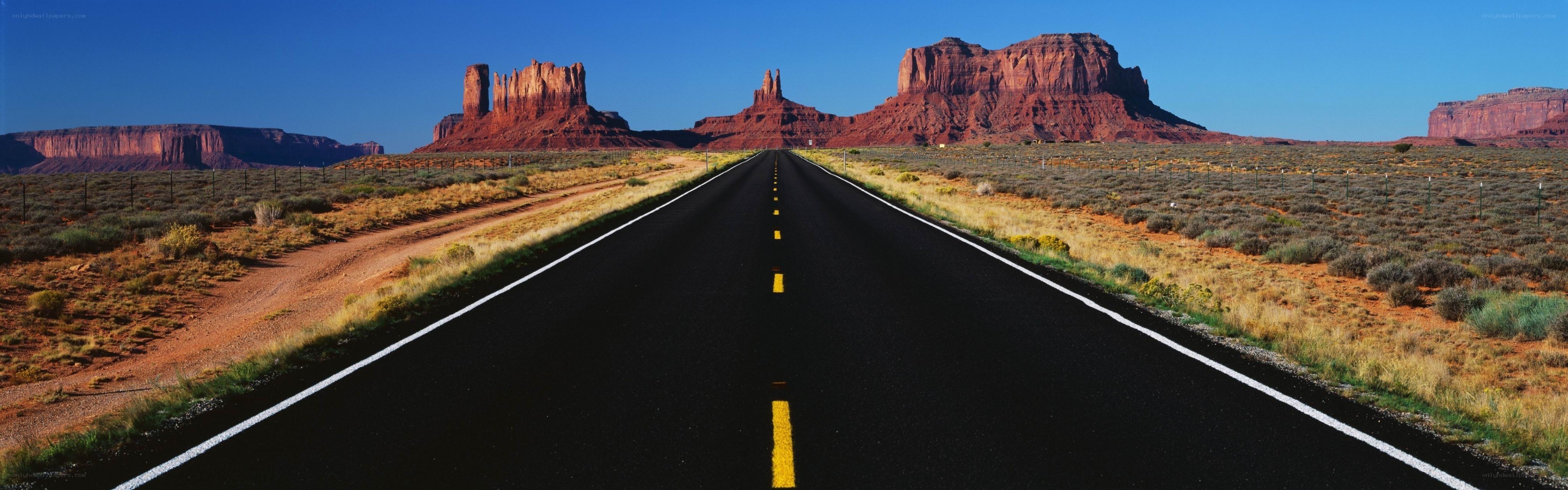 Desert highway with rock formations