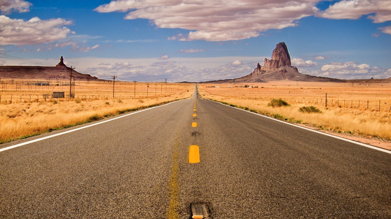 Desert highway with rock formations