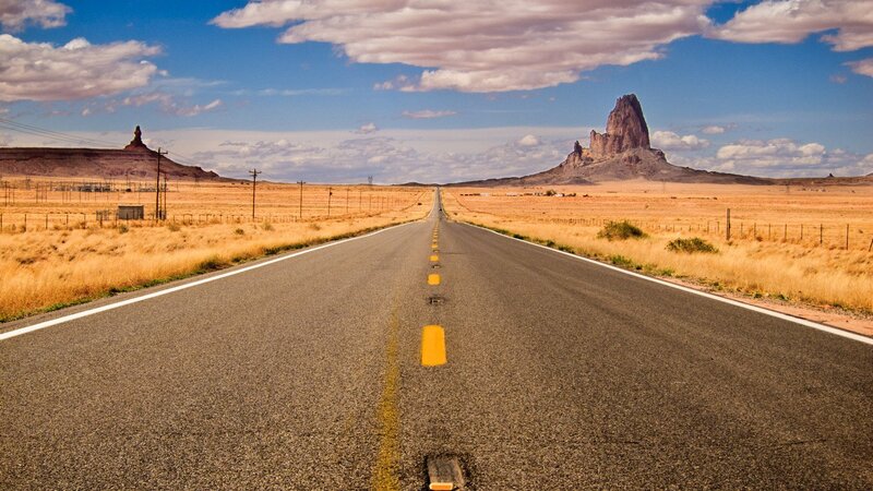 Desert Highway with Rock Formations — Blue