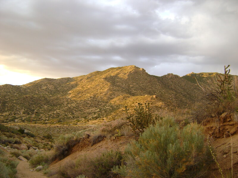 Desert hills under cloudy sky