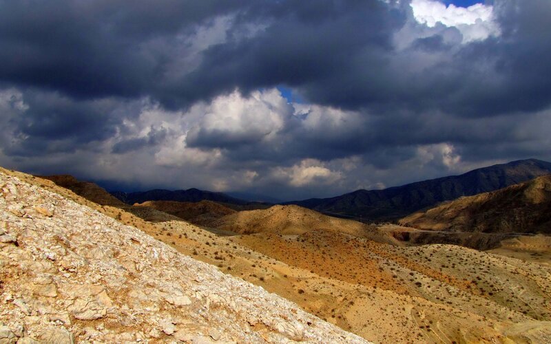 Desert Hills under Stormy Sky
