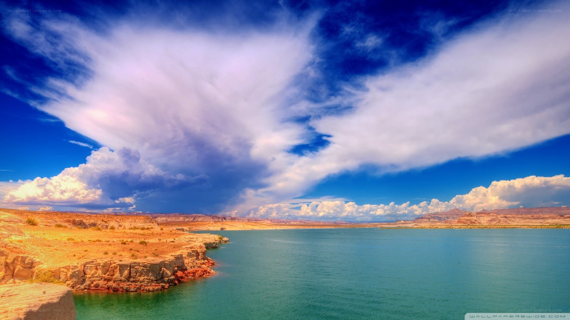 Desert lake under dramatic sky