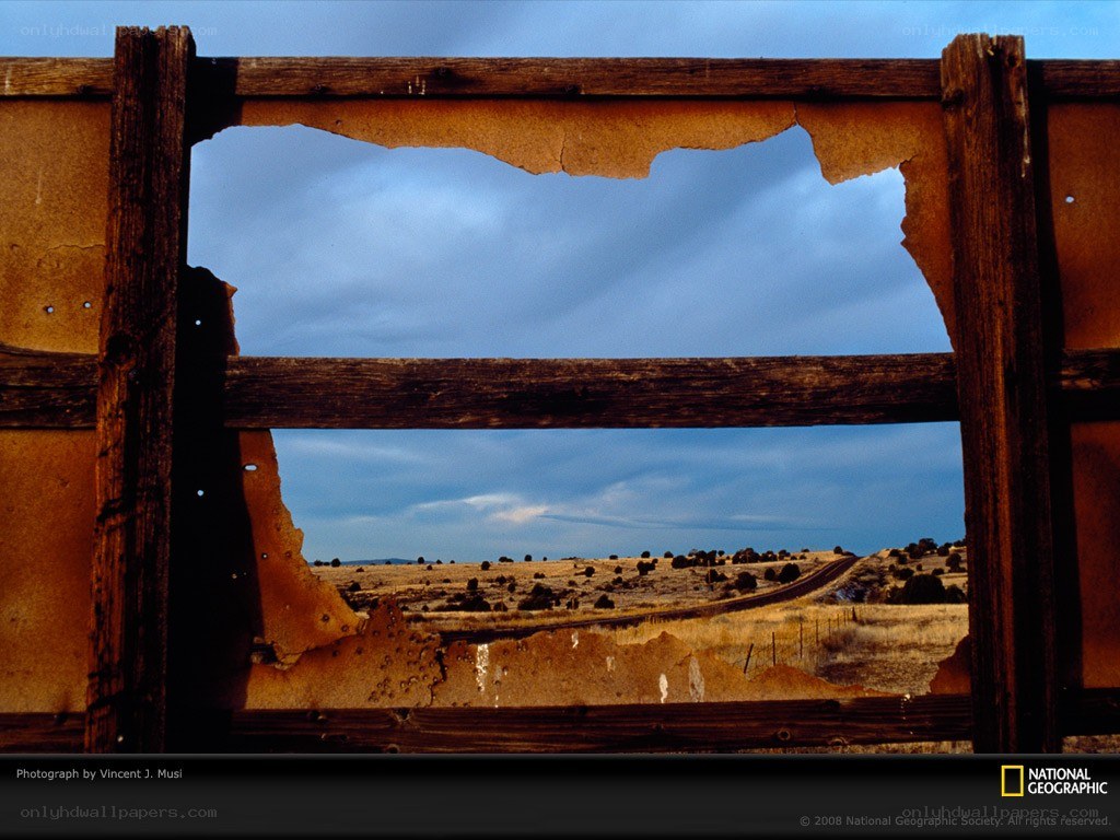 Desert landscape through a broken window