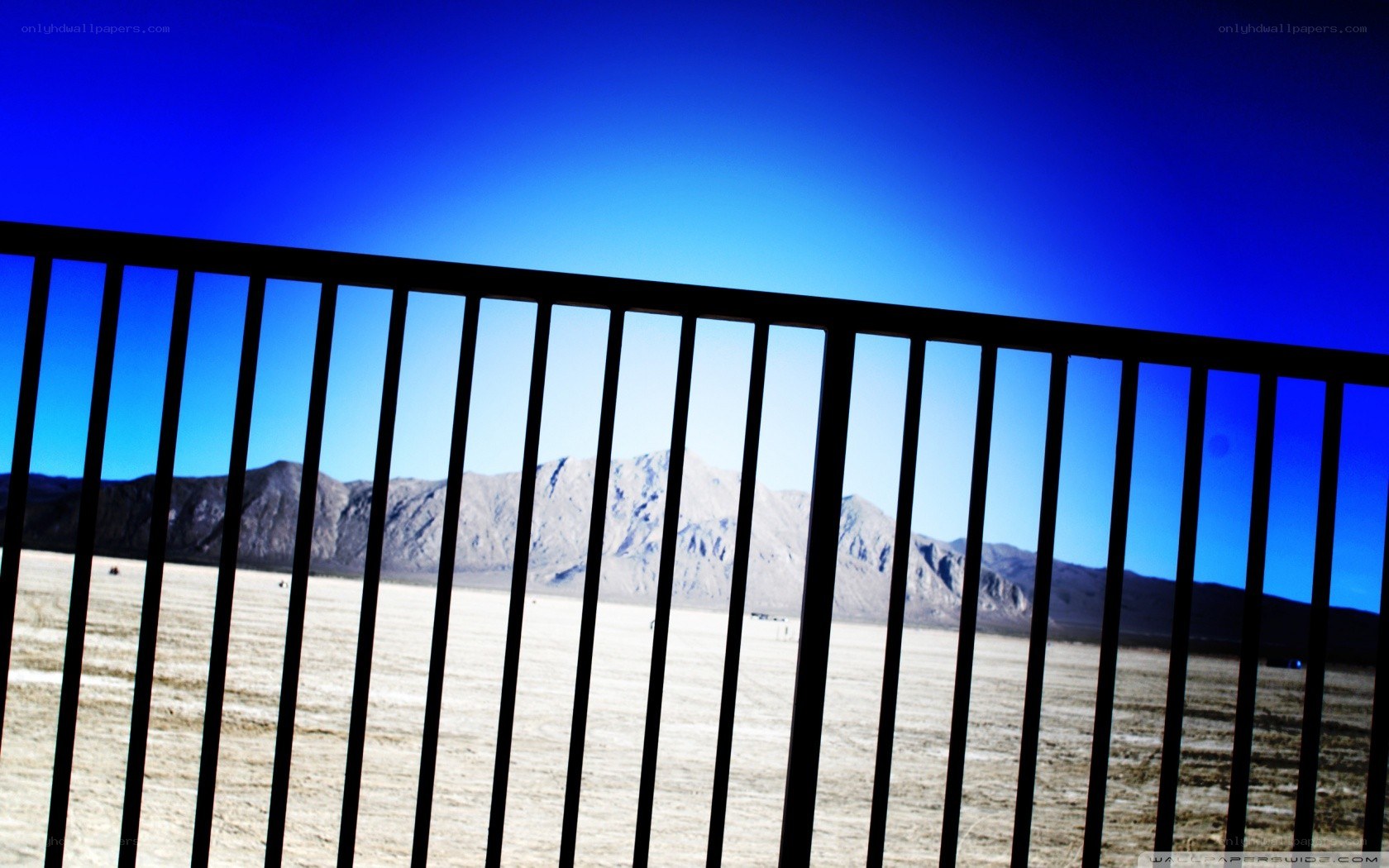 Desert landscape through railing