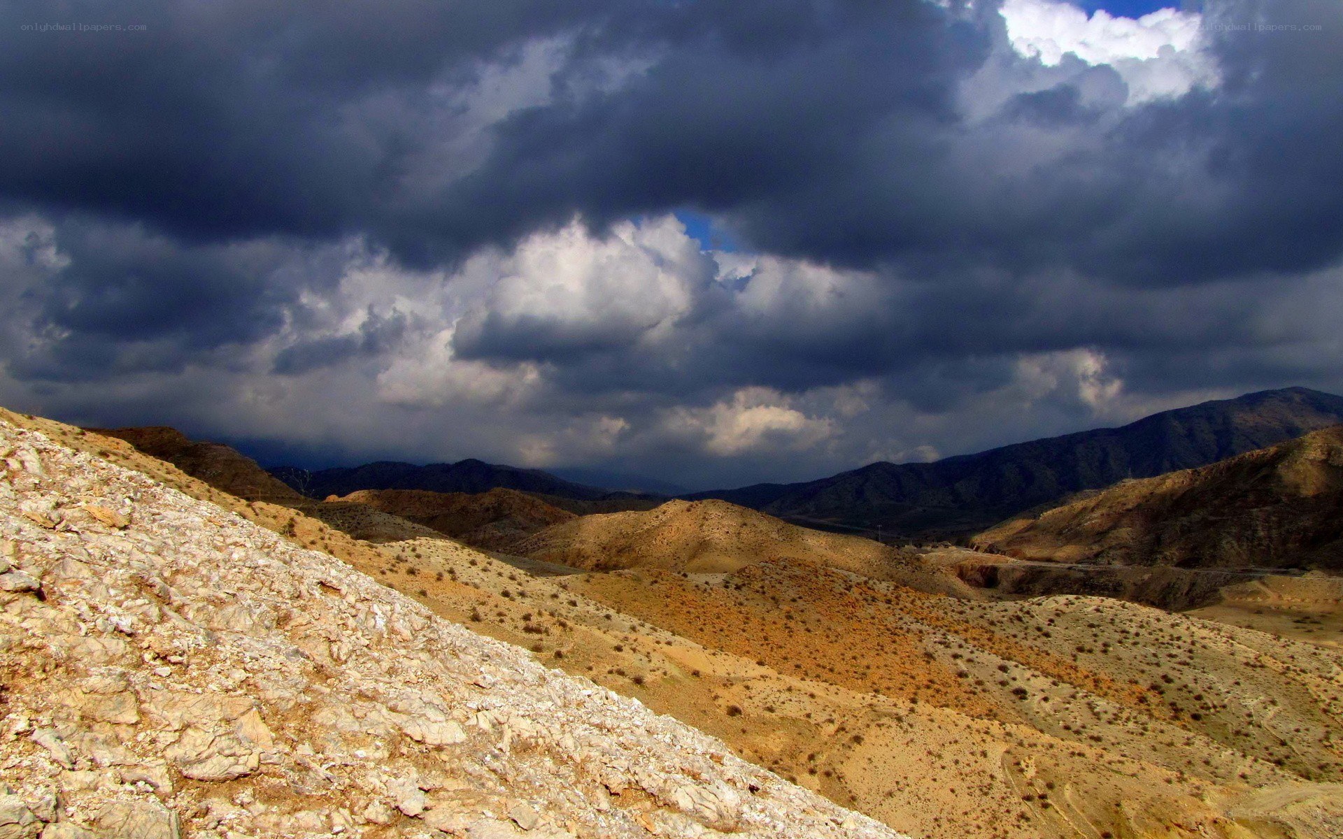 Desert landscape under stormy sky