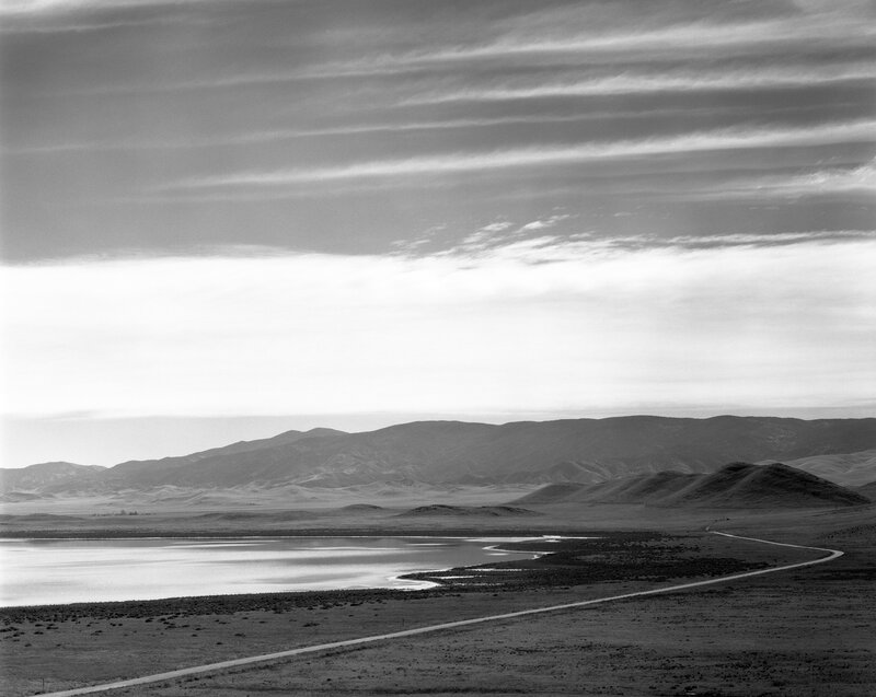 Desert landscape with lake and mountains