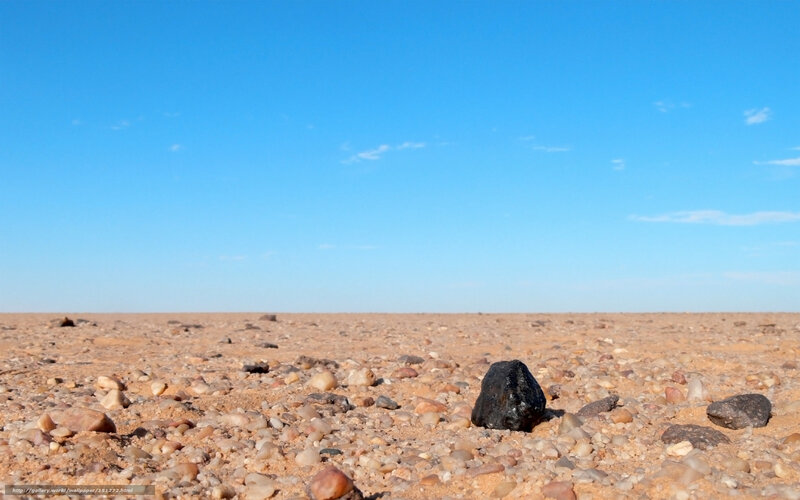 Desert landscape with meteorite