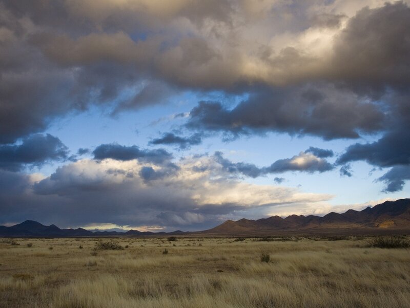 Desert landscape with stormy sky