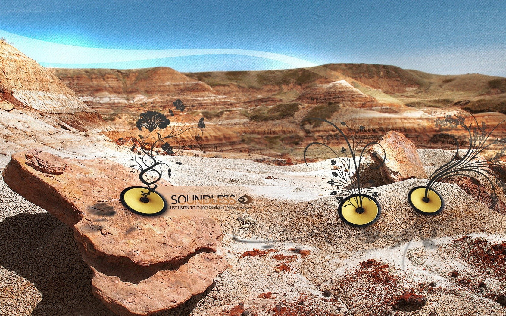 Desert landscape with stylized speakers