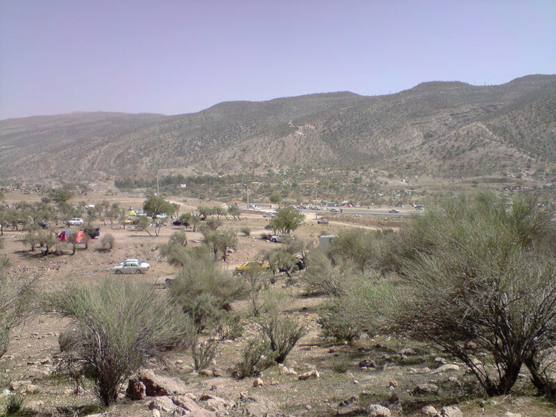 Desert landscape with vehicles