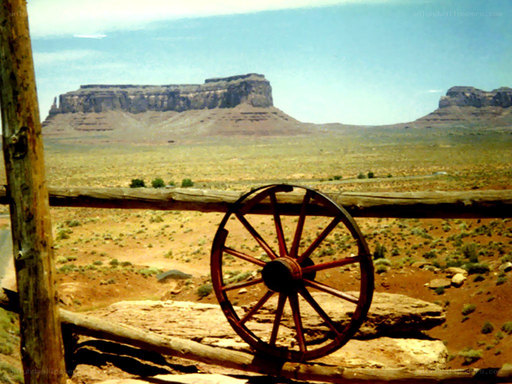 Desert landscape with wagon wheel