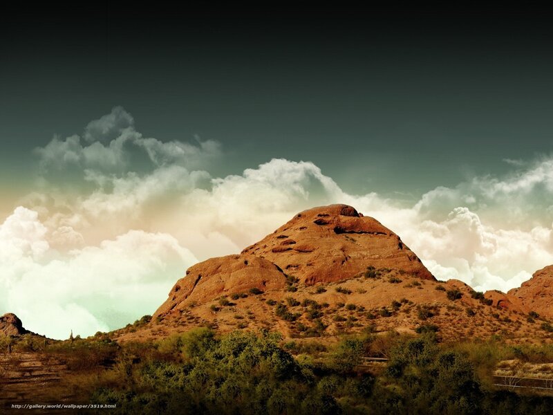 Desert mountain under cloudy sky