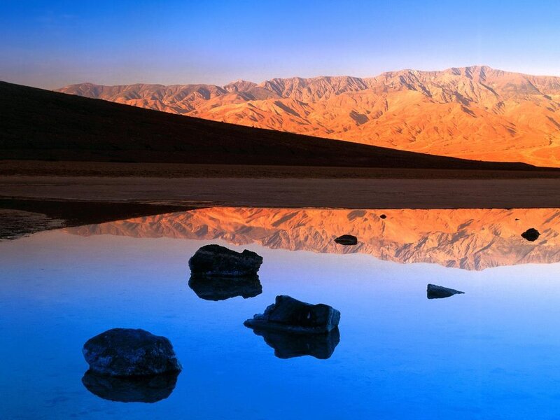 Desert mountains reflected in water
