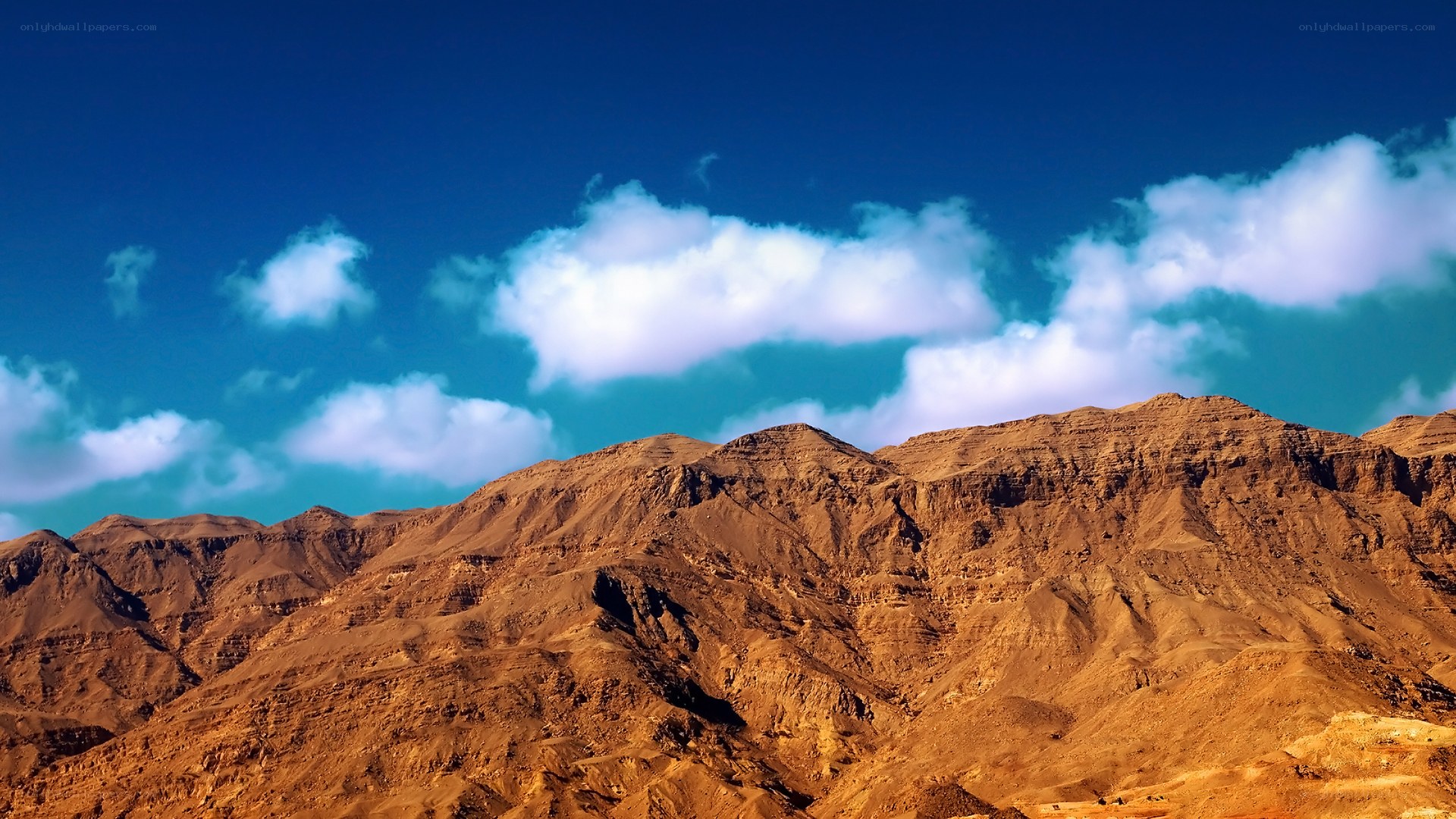 Desert mountains under blue sky