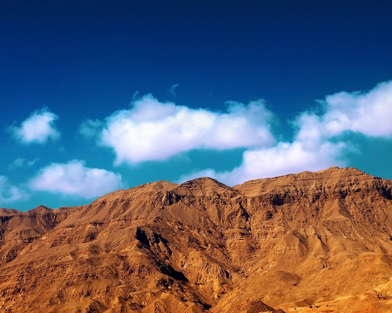 Desert mountains under blue sky