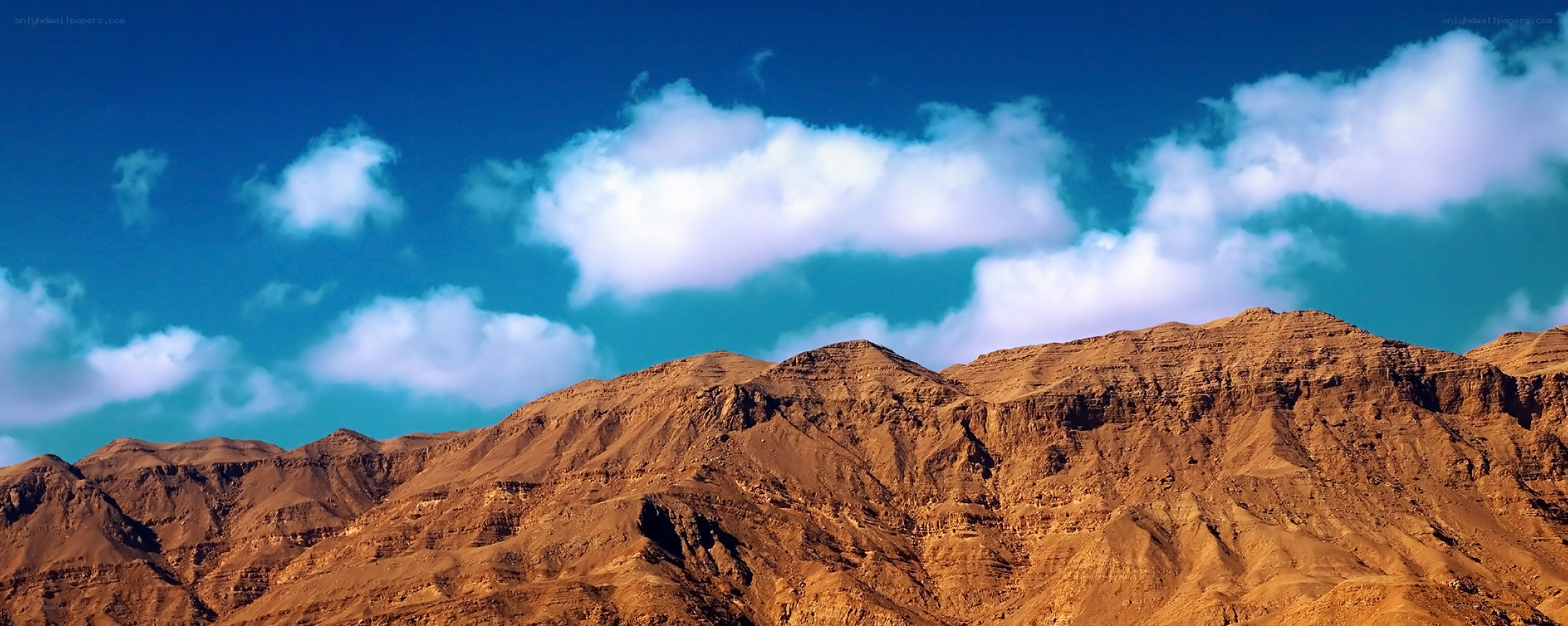 Desert mountains under blue sky