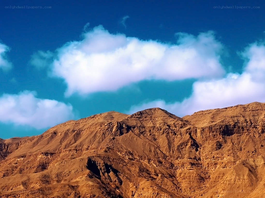 Desert mountains under blue sky