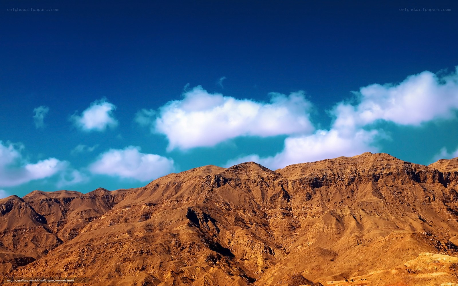 Desert mountains under blue sky