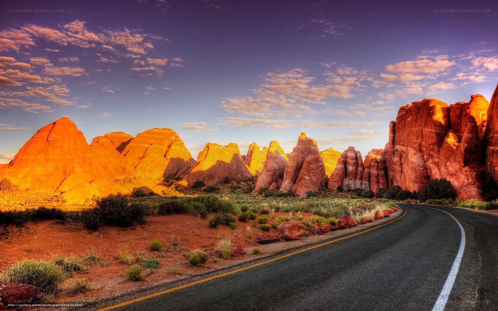 Desert road at sunset