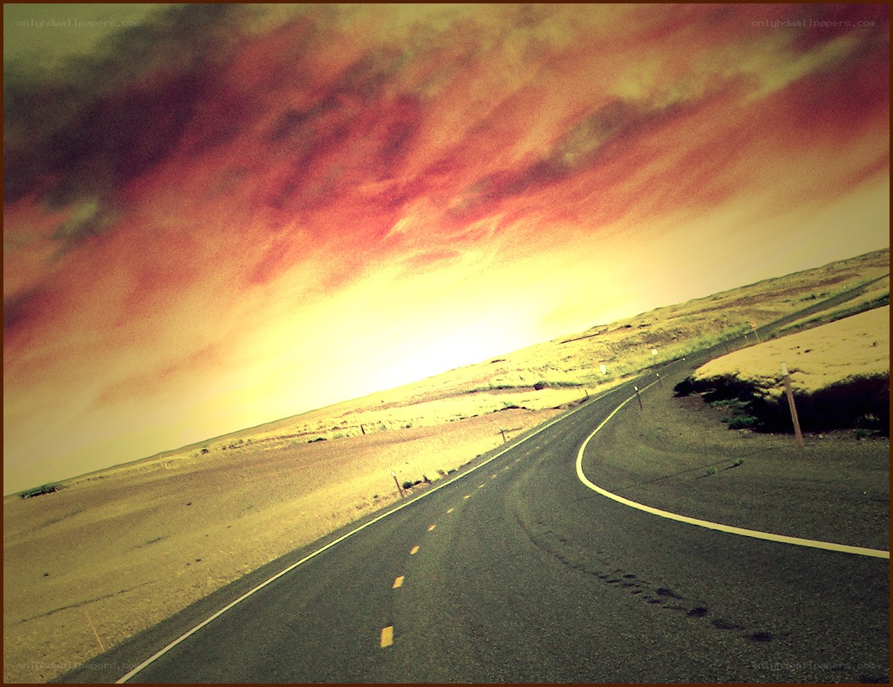 Desert road at sunset
