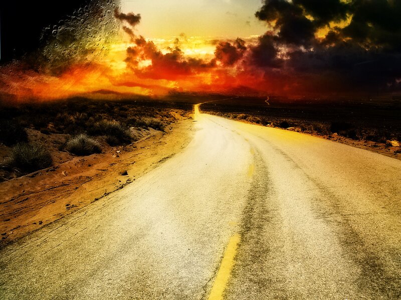 Desert road at sunset