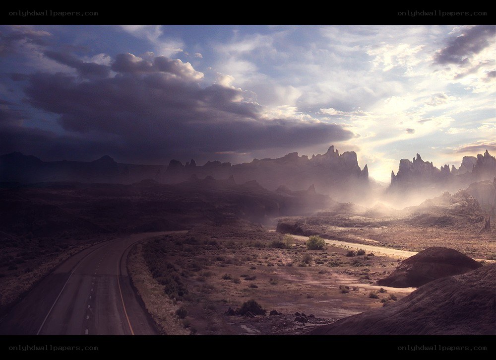 Desert road at sunset