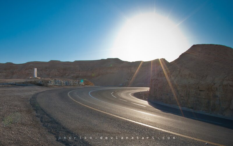 Desert road at sunset