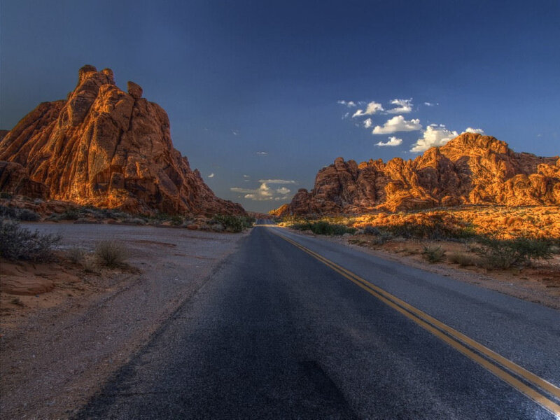 Desert road at sunset
