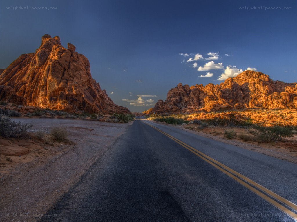 Desert road at sunset