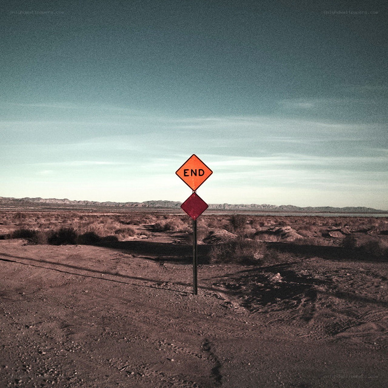Desert road sign with 'END' marker